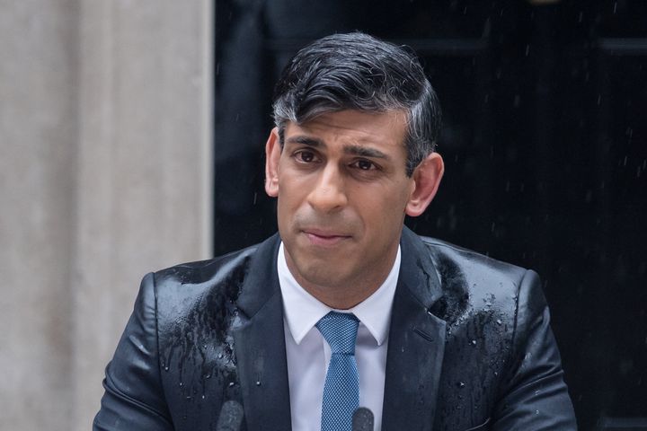 British Prime Minister Rishi Sunak makes a statement amid rain outside 10 Downing St. in London on May 22, announcing that the U.K. general election will take place July 4.