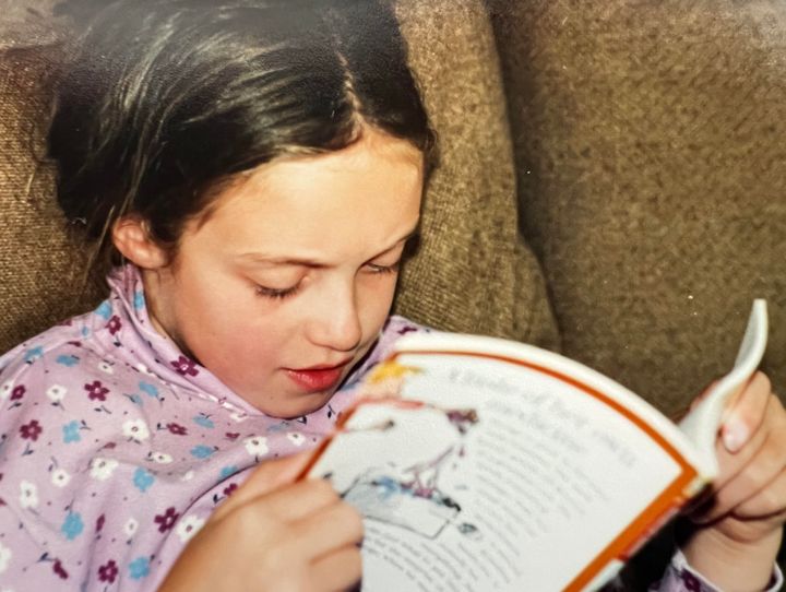 Nina reading at home in 2001.