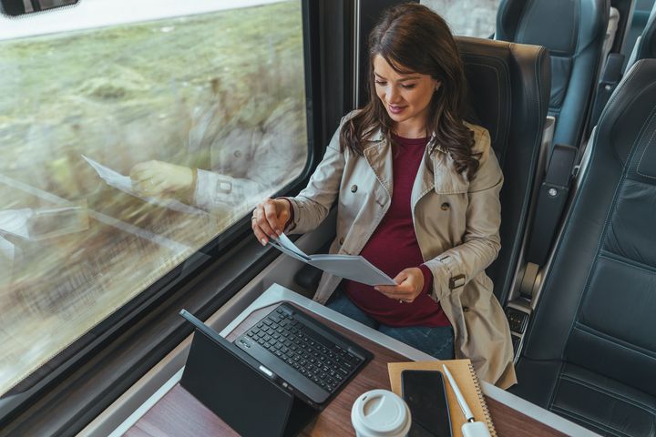 Woman using her phone while commuting