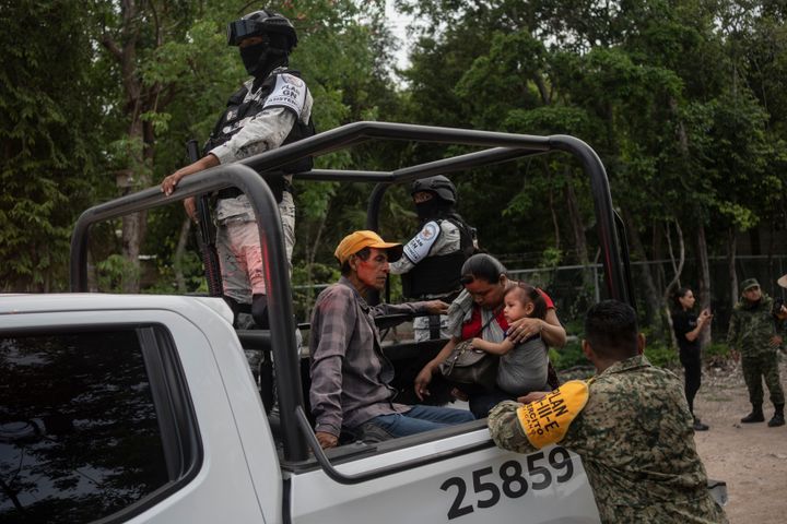 Miguel and Francisca, along with their young son, are taken to an emergency shelter by the National Guard ahead of the arrival of Hurricane Beryl in Tulum, Mexico. (Photo by Felix Marquez/picture alliance via Getty Images)