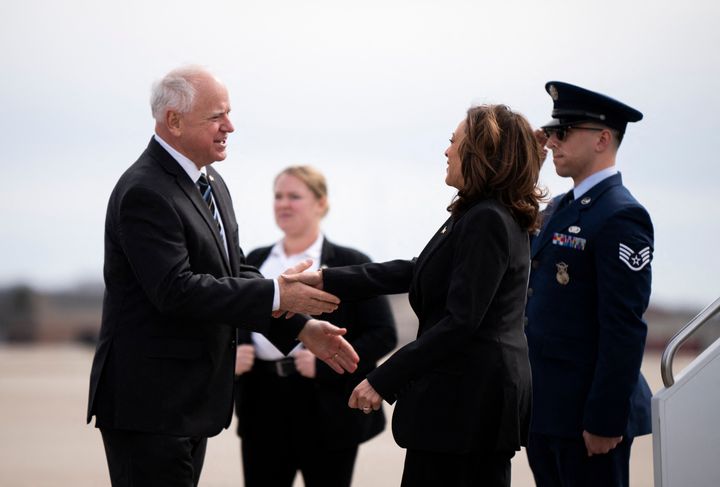 Walz greets Harris as she arrives at the Minneapolis-St. Paul International Airport in Saint Paul, Minnesota, on March 14, 2024. Walz is now Harris' running mate.