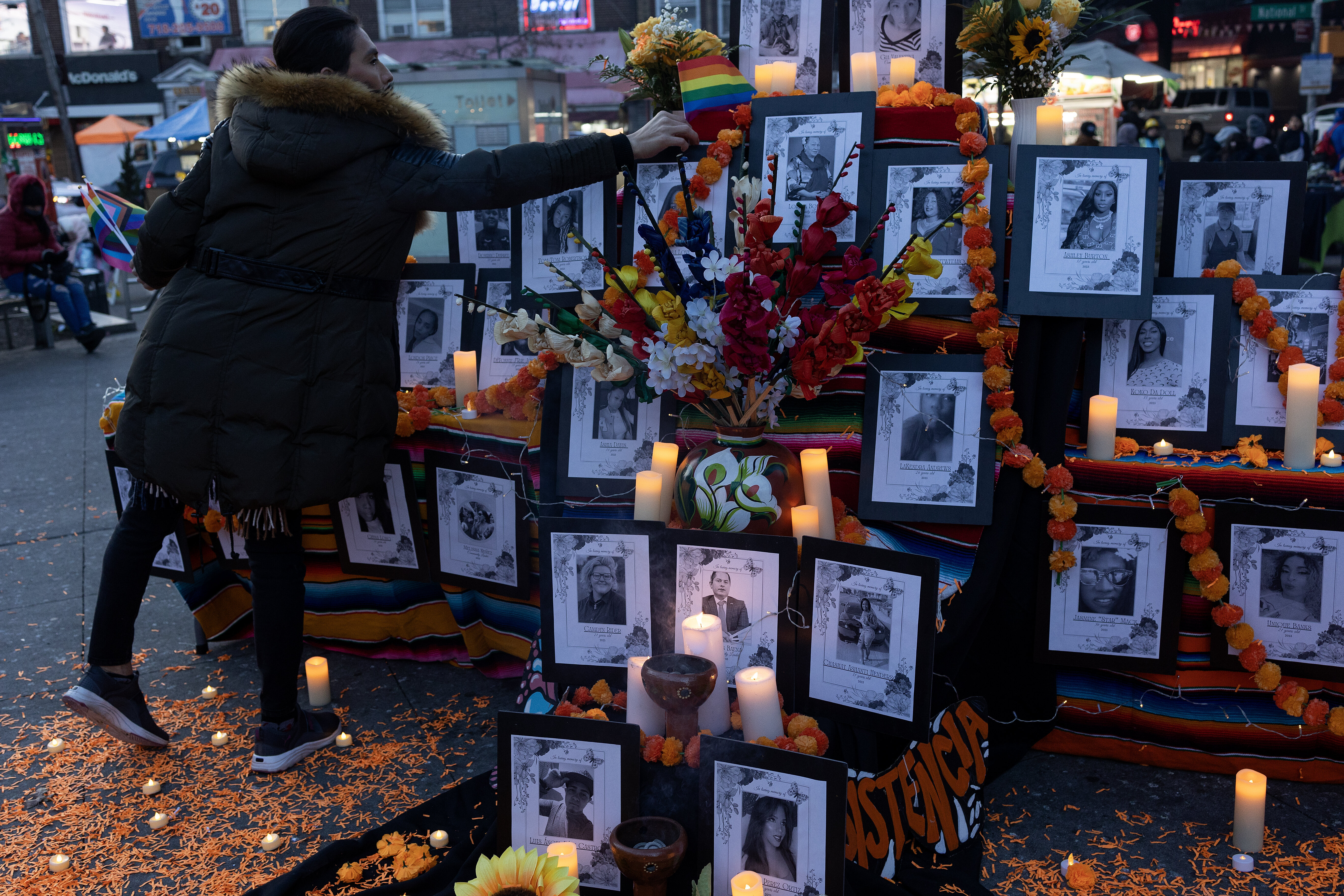 Members of the Queens Latino trans community and their allies set up a memorial for trans people killed across America, Nov. 20, 2023, in the Corona neighborhood of Queens, New York. 