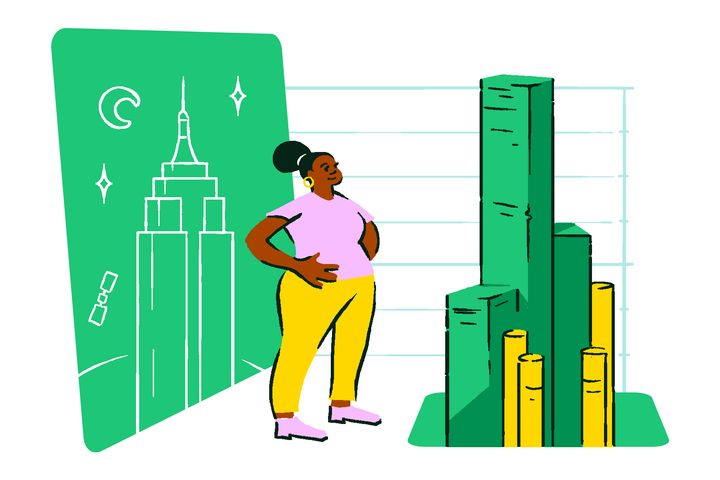 A woman standing next to a drawing of the Empire State Building and piles of money