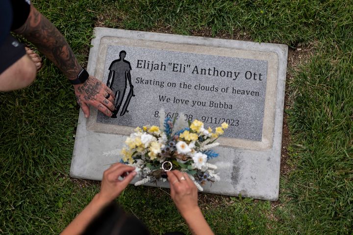 Mikayla Brown and her husband, Tyler, visit the grave of their son, Elijah, who died of a fentanyl overdose at 15, in Paso Robles, California, Friday, Aug. 2, 2024.