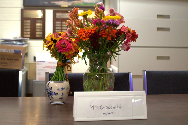 Flowers sit on a table where slain Pawlet Select Board member Brian Crossman usually sat during meetings, Sept. 17, 2024, in Pawlet, Vermont.