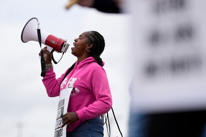 Striking longshoreman Teresa Whitte, of New York, pickets outside the Packer Avenue Marine Terminal Port, Tuesday, Oct. 1, 2024, in Philadelphia. 