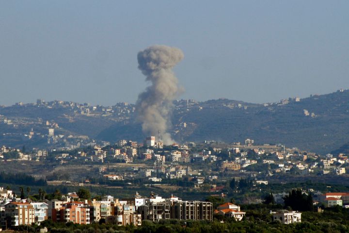 This picture taken from the southern city of Tyre shows smoke billowing from the site of an Israeli aistrike. (Photo by KAWNAT HAJU/AFP via Getty Images)