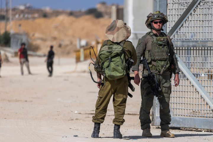 Israeli troops stand guard at northern Gaza's Erez crossing, where humanitarian aid continues to be blocked for Palestinians, on May 5, 2024.