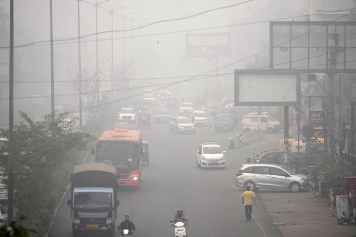 Commuters drive through a thick layer of smog as air pollution shoots up in New Delhi, India, on Nov. 18, 2024.