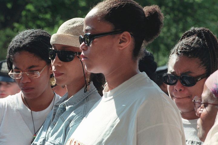 Malcolm X's daughters Malikah Shabazz, left, Attallah Shabazz, second from left, Malaak Shabazz, third from left, and Gamilah Shabazz, talk to the media following the death of their mother, Betty Shabazz, June 23, 1997. 