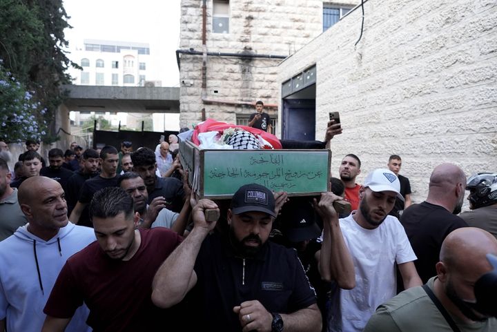 Palestinians hold a funeral procession for 12-year-old Hatim Gays, who was shot dead by Israeli soldiers in the Qalendiya refugee camp north of East Jerusalem, on Oct. 7, 2024.