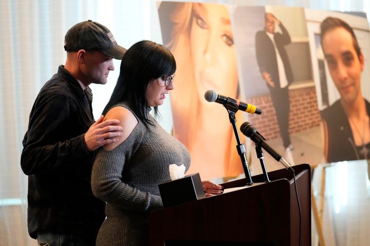 Ashtin Gamblin, survivor of the Club Q nightclub mass shooting in Colorado Springs, Colo., is consoled by her husband Robert Conner Jr., during a news conference announcing the filing of a civil complaint on the two-year anniversary of the deadly mass shooting, Tuesday, Nov. 19, 2024, in Denver. 