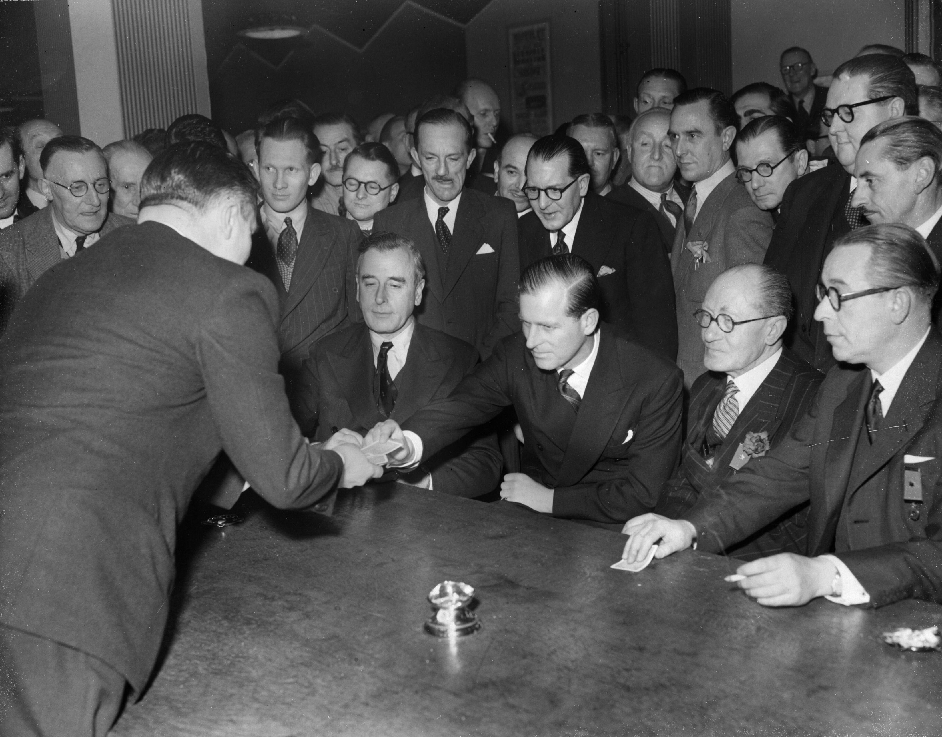 The Duke of Edinburgh takes a card at The Magic Circle headquarters in 1955. The historic club prohibited women from joining until 1991.