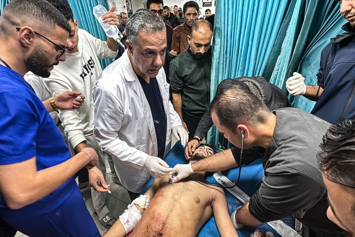 Dr. Hussam Abu Safiya (center), director of Kamal Adwan Hospital, supervises the treatment of a Palestinian man who was injured in an Israeli strike on Beit Lahia in the northern Gaza Strip on Nov. 21, 2024.