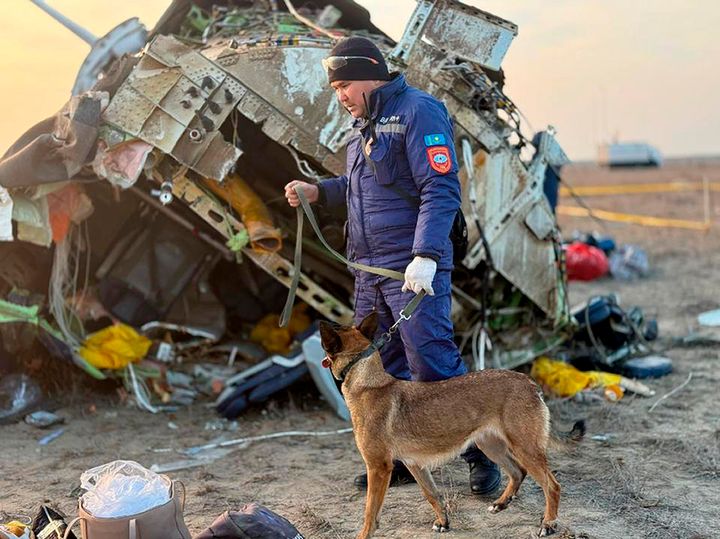 In this photo released by Kazakhstan's Emergency Ministry Press Service, rescuers work at the wreckage of Azerbaijan Airlines Embraer 190 lays on the ground near the airport of Aktau, Kazakhstan, Thursday, Dec. 26, 2024. (Kazakhstan's Emergency Ministry Press Service via AP)