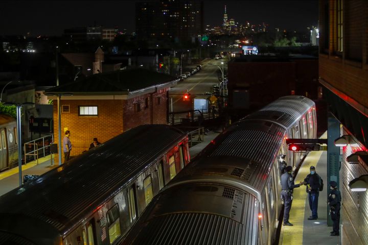 New York Police officers clear a train at the Coney Island Stillwell Avenue Terminal, May 5, 2020, in the Brooklyn borough of New York. 