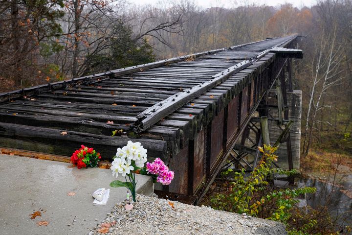 Flowers are placed at the Monon High Bridge Trail in Delphi, Indiana, on Oct. 31, 2022, near where Libby German and Abby Williams were last seen and where the bodies were discovered.