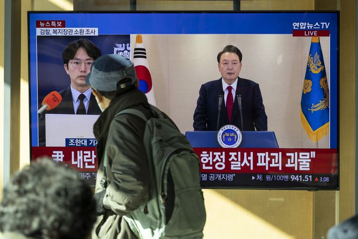 A television screen displays a news report featuring South Korean President Yoon Suk Yeol at Seoul Station in Seoul, South Korea, on Thursday, Dec. 12, 2024. Yoon said he would fight until the last minute to defend himself after accusing the opposition of trying to paralyze his administration. Yoon's defiant Thursday morning speech came as the chief of his own party called for his impeachment. Photographer: Jean Chung/Bloomberg via Getty Images