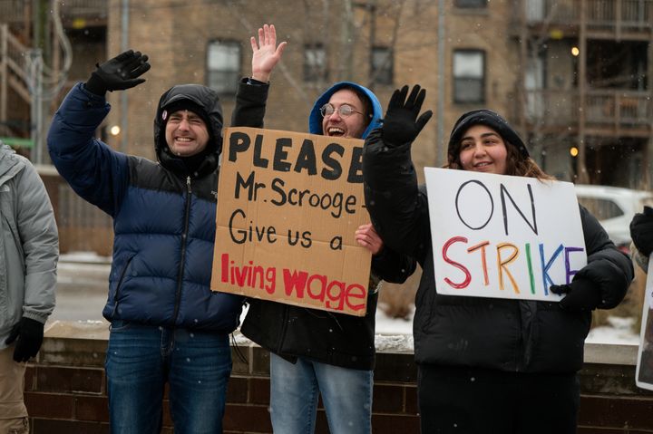 Members of the Starbucks Workers United union picket outside a Starbucks store in Chicago on Friday, Dec. 20, 2024.