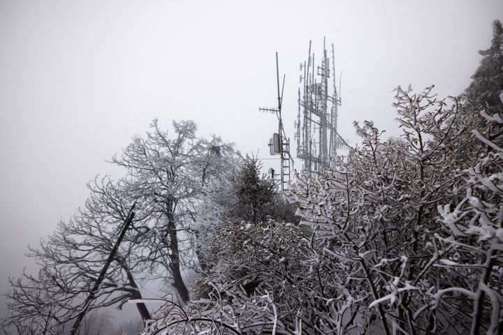 Snow accumulates on a structure that was destroyed by the Eaton Fire near major communications towers on Mount Wilson near the northern perimeter of the fire, approximately 5,000 above the city, as much-anticipated rain and snow fall on Jan. 26, 2025, near Altadena, California.