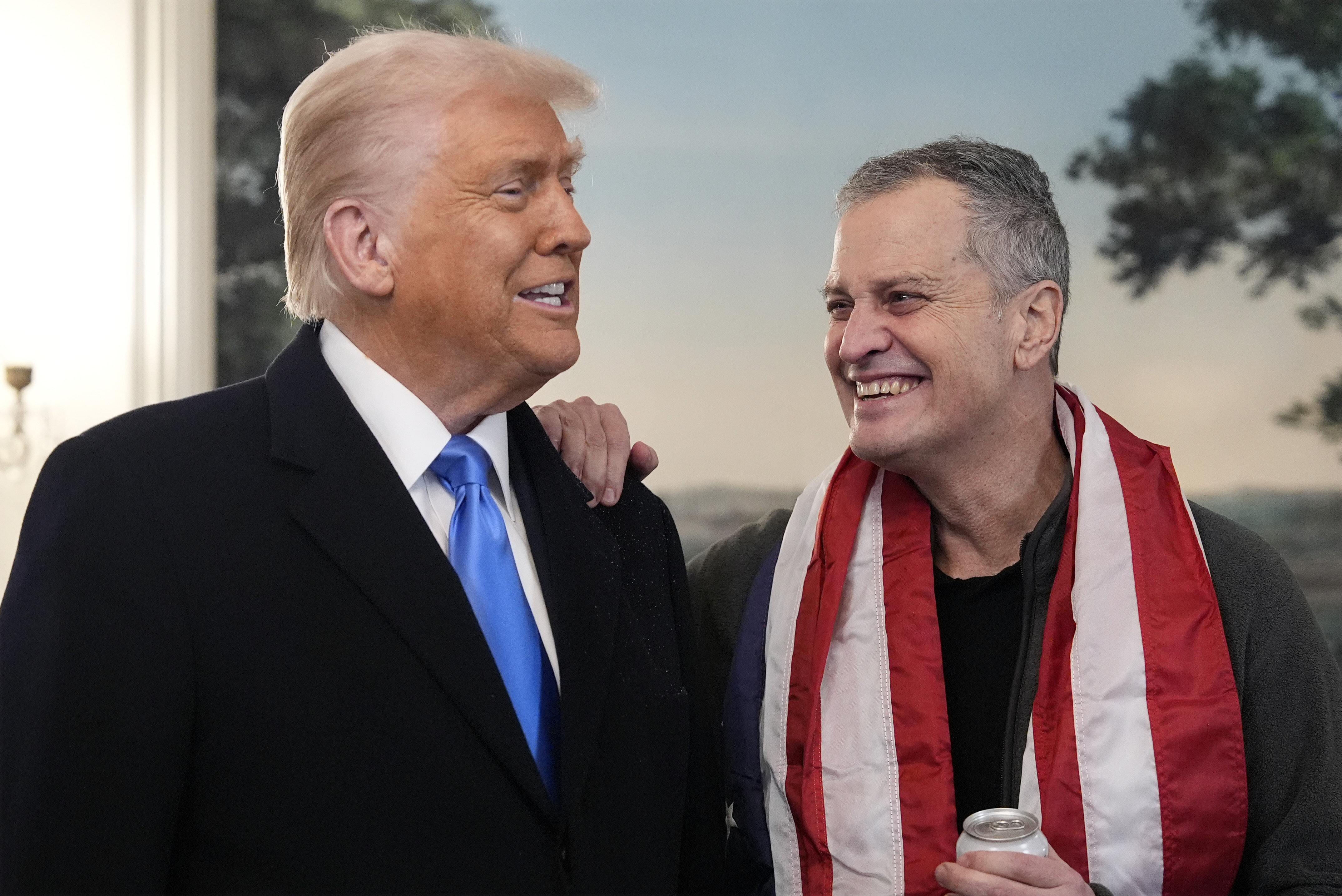 President Donald Trump, accompanied by Marc Fogel, speaks in the Diplomatic Reception Room at the White House, on Feb. 11, 2025, in Washington.