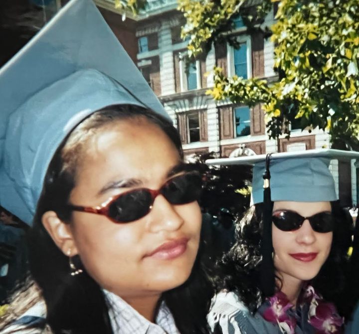 The author (right) and Nisha at their college graduation in May, 2022. "Here we are sneering in our sunglasses at all the pomp of graduation, not yet two months after Nisha's first transplant," she writes.