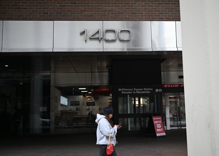 A person walks outside the U.S. African Development Foundation's headquarters in Washington. Several employees of Elon Musk's DOGE organization accessed the building on March 6, 2024.