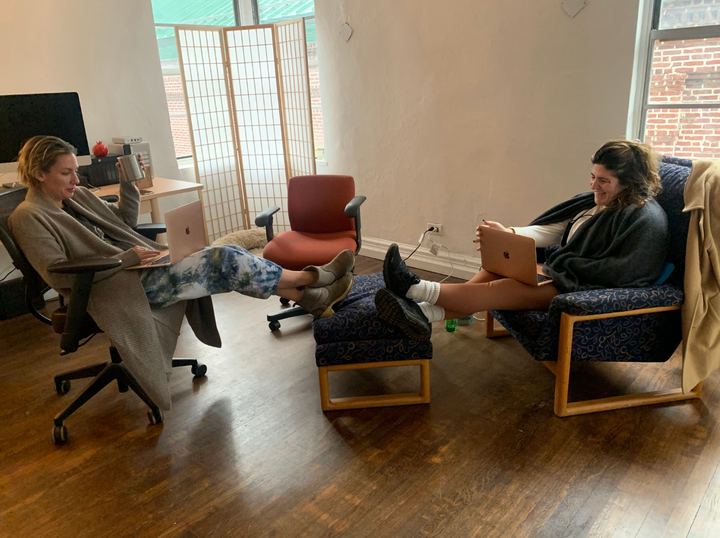 The author (right) and her writing and podcast partner, Rachel Webster, working on "Debt Heads."