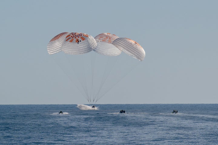 The SpaceX Dragon spacecraft is seen as it lands with NASA astronauts Nick Hague, Suni Williams, Butch Wilmore, and Roscosmos cosmonaut Aleksandr Gorbunov aboard.