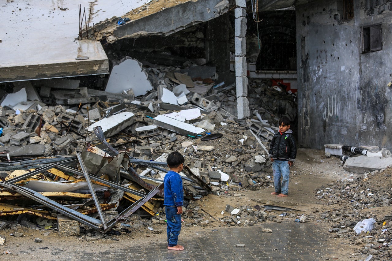 Palestinian children stand among the rubble of buildings destroyed by Israeli attacks in Khan Younis, Gaza, on Feb. 22, 2025.