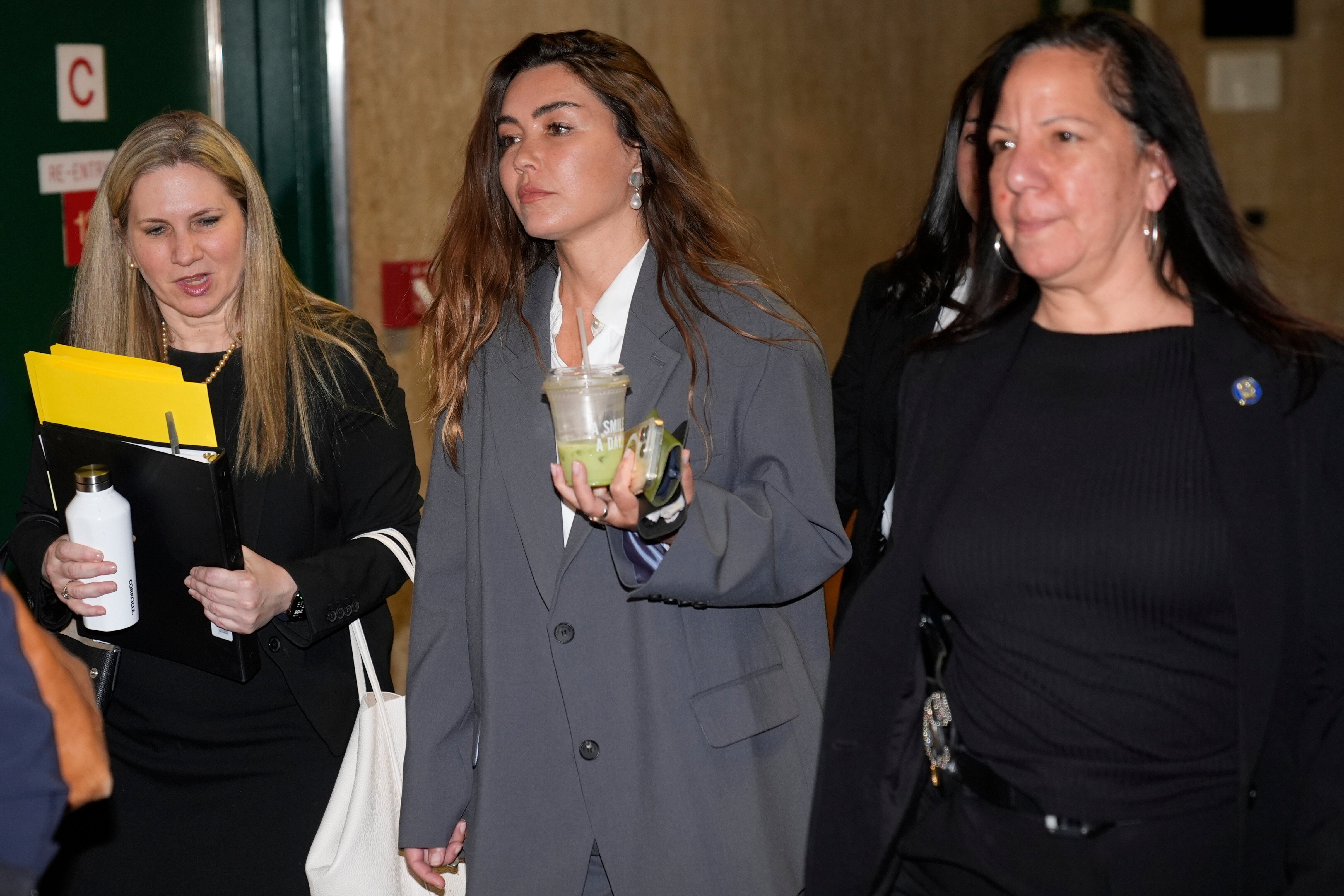 Miriam Haley, center, an accuser testifying at Harvey Weinstein's rape trial, arrives to the courtroom after a break in New York, Tuesday, April 29, 2025.