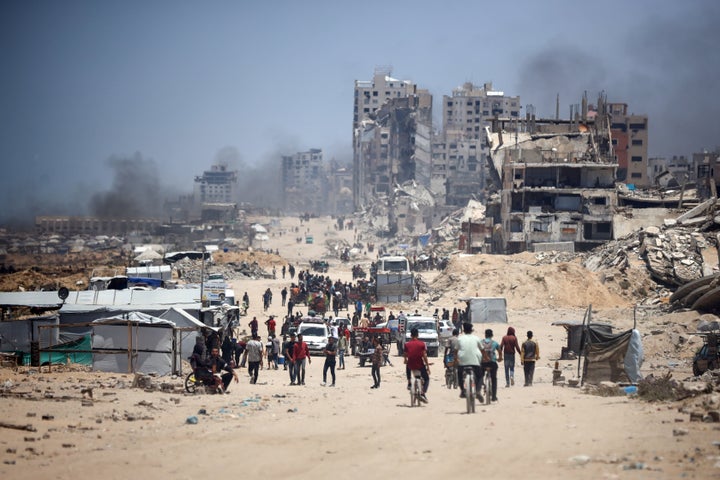 People commute Sunday along Gaza's al-Rashid road, the only route linking the northern and southern parts of the Palestinian territory.