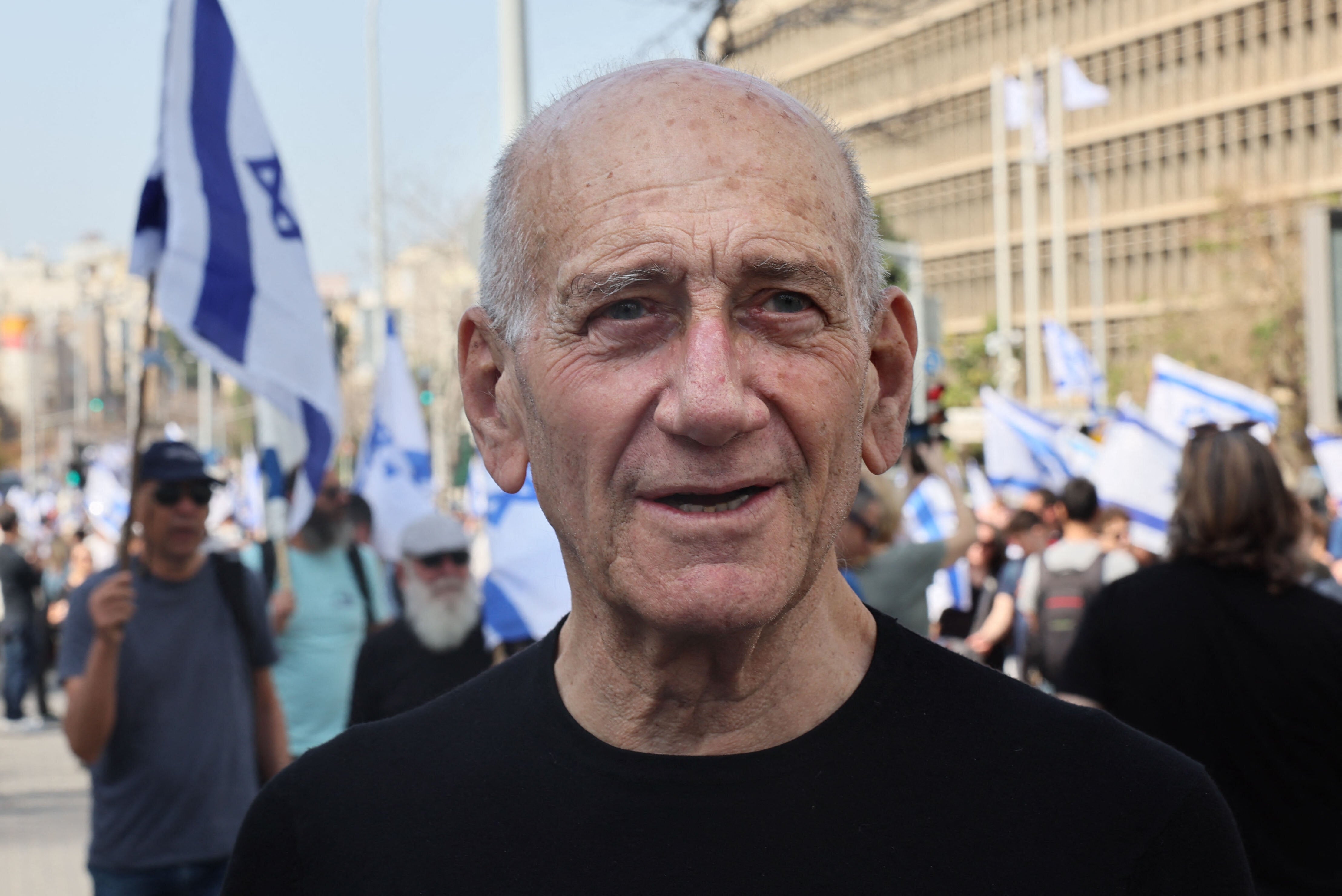 Last week, former Israeli Prime Minister Ehud Olmert, seen here at a March 2023 demonstration in Tel Aviv, wrote an op-ed condemning his country for committing "war crimes" in Gaza.