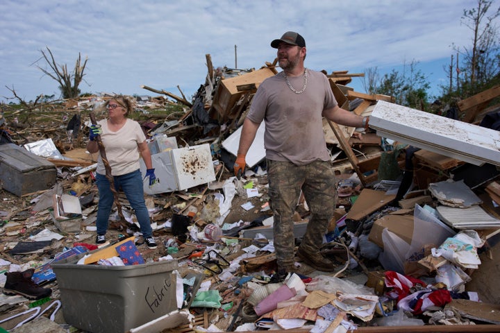 Edwina Wilson, left, and family friend Melvin Brock sift through what is left of Wilson's destroyed home, Sunday, May 18, 2025, in London, Ky., after a severe storm passed through the area. (AP Photo/Carolyn Kaster)