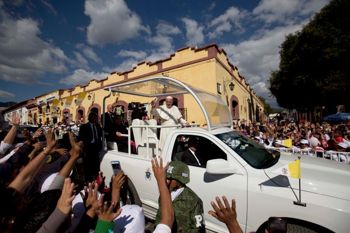 Pope Francis waves from his popemobile as he leaves the Cathedral in San Cristobal de las Casas, Mexico, in 2016.