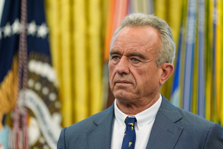 Robert F. Kennedy Jr. watches as President Donald Trump speaks with reporters on May 5.