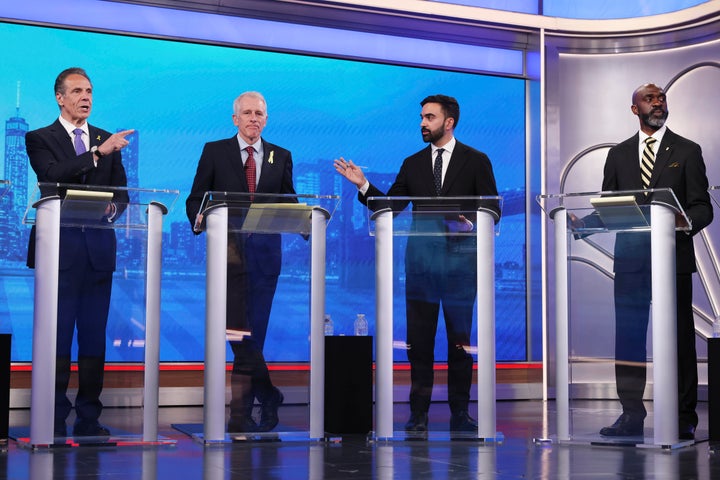 Democratic mayoral candidates Andrew Cuomo, far left, and Zohran Mamdani, second from right, present arguments as Whitney Tilson, second from left, and Michael Blake look on during a Democratic mayoral primary debate, Wednesday, June 4, 2025, in New York. (AP Photo/Yuki Iwamura, Pool)