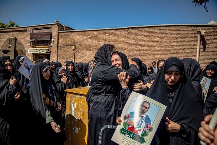 Iranian women mourn at a funeral for three people who were killed in Israel's attacks in Kermanshah and Tehran, in Qazvin, Iran, on June 19, 2025. The Islamic Revolutionary Guard Corps' Mohammad Amin Ebrahimi, nuclear scientist Dr. Mehdi Khosravinejad and draftee Pouya Amousa were killed in separate Israeli strikes.
