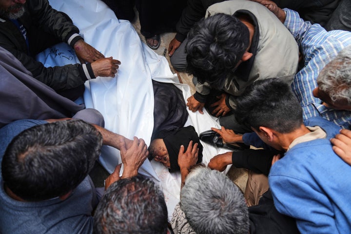 Palestinians mourn over the body of Reem Al-Akhras during her funeral at Nasser Hospital in Khan Younis, Gaza, on June 3, 2025. Israeli forces killed Al-Akhras and 26 other Palestinians on their way to an aid hub operating under a new, widely condemned U.S.-Israeli system.