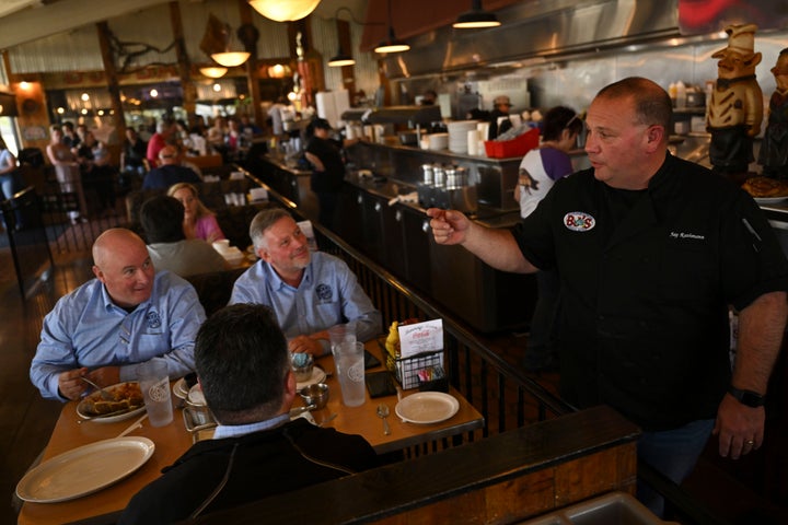 Owner and chef Jay Rathmann of BJ's Nevada Barbecue is shown here serving customers.
