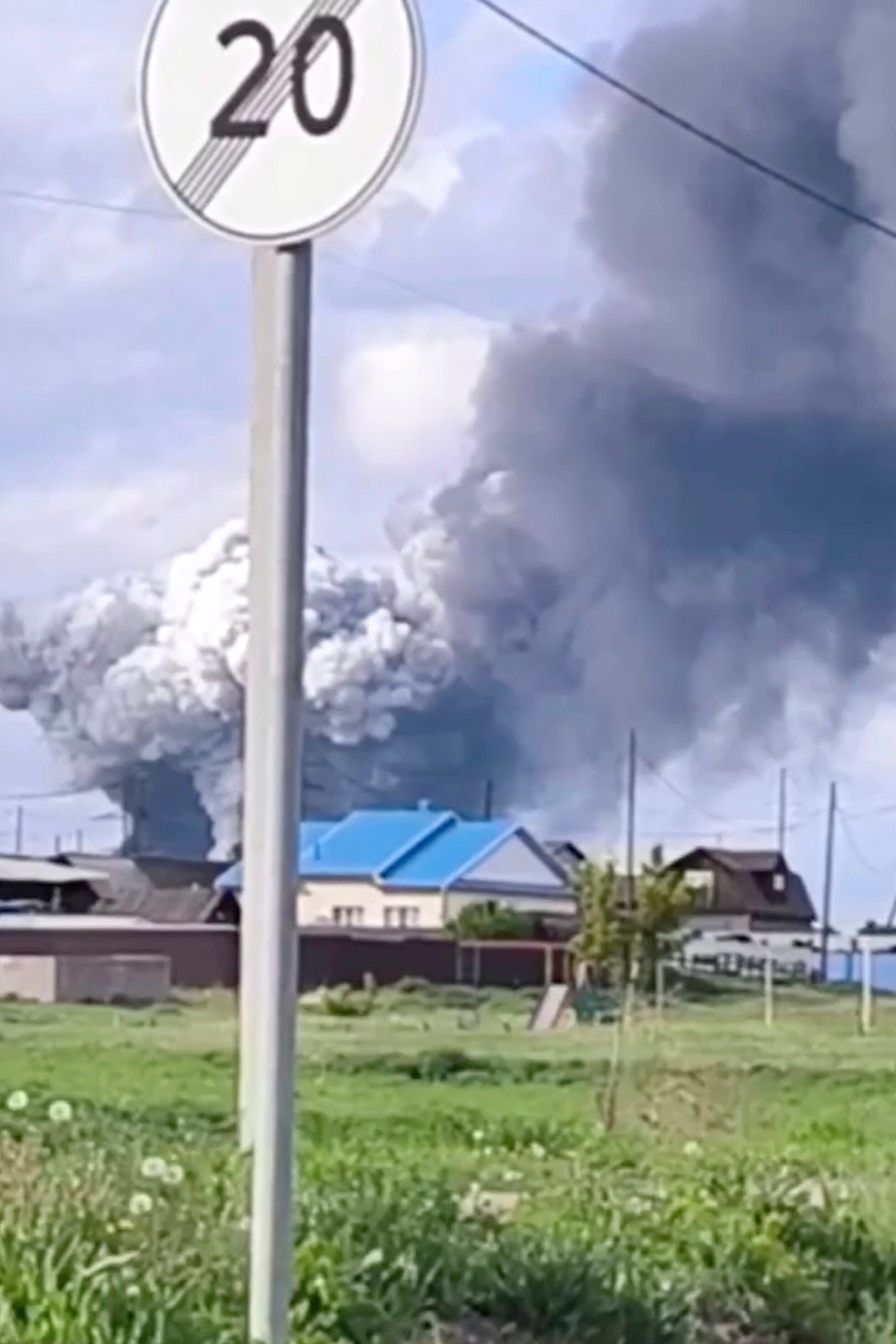 Plumes of smoke are seen rising over the Belaya air base in the Irkutsk region in eastern Siberia after a Ukrainian drone attack in the Irkutsk region, more than 2,500 miles from Ukraine.